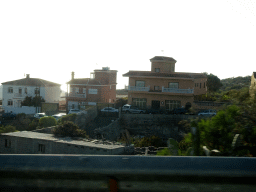 Houses at the north side of the town of La Camella, viewed from the rental car on the TF-51 road