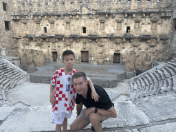 Tim and Max at the diazoma of the west auditorium of the Roman Theatre of Aspendos, with a view on the orchestra, stage and stage building