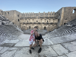 Tim and Max at the diazoma of the west auditorium of the Roman Theatre of Aspendos, with a view on the orchestra, stage and stage building