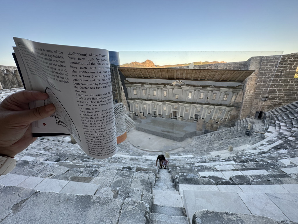 Tim and Max at the southwest auditorium of the Roman Theatre of Aspendos, with a view on the orchestra, stage and stage building and a reconstruction in a travel guide