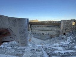 Reconstruction in a travel guide at the top of the southwest auditorium of the Roman Theatre of Aspendos, with a view on the orchestra, stage and stage building