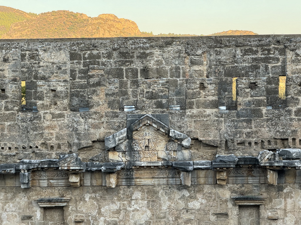 Reliefs at the stage building of the Roman Theatre of Aspendos and the hills on the northeast side, viewed from the top of the west auditorium