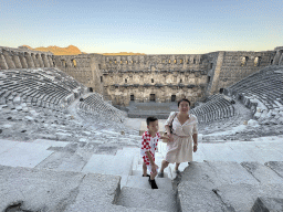 Miaomiao and Max at the top of the west auditorium of the Roman Theatre of Aspendos, with a view on the auditorium, orchestra, stage and stage building