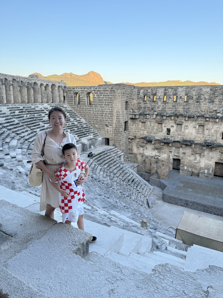 Miaomiao and Max at the top of the west auditorium of the Roman Theatre of Aspendos, with a view on the north auditorium, orchestra, stage and stage building