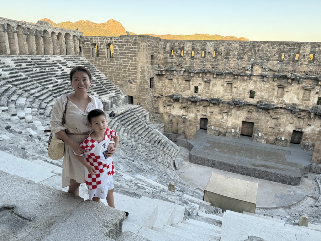 Miaomiao and Max at the top of the west auditorium of the Roman Theatre of Aspendos, with a view on the north auditorium, orchestra, stage and stage building