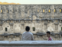 Miaomiao and Max at the top of the west auditorium of the Roman Theatre of Aspendos, with a view on the stage building