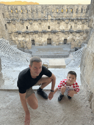 Tim and Max at the top of the west auditorium of the Roman Theatre of Aspendos, with a view on the auditorium, orchestra, stage and stage building