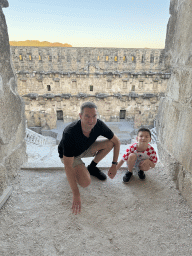 Tim and Max at the top of the west auditorium of the Roman Theatre of Aspendos, with a view on the stage and stage building
