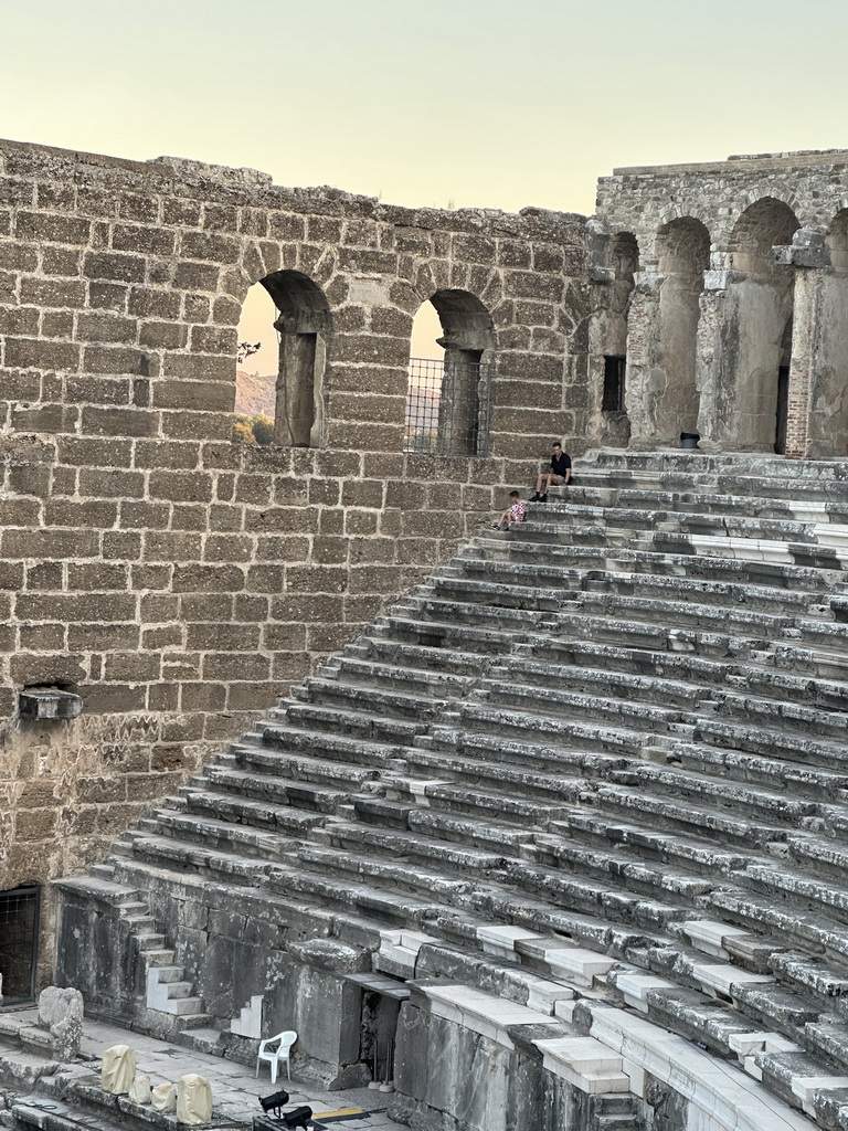 Tim and Max climbing down the south auditorium of the Roman Theatre of Aspendos, viewed from the top of the west auditorium