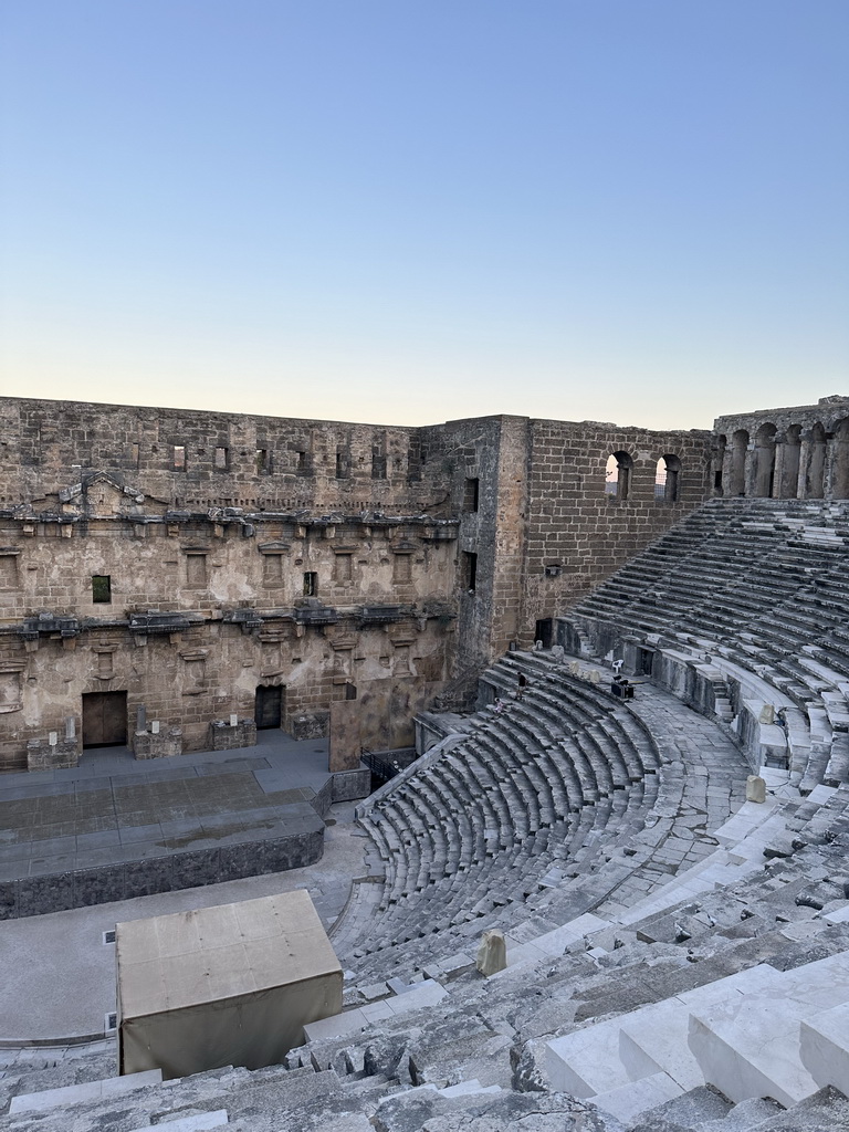 Tim and Max climbing down the south auditorium of the Roman Theatre of Aspendos, viewed from the top of the west auditorium