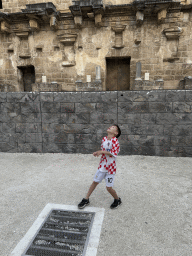 Max throwing a coin at the orchestra of the Roman Theatre of Aspendos