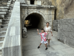 Miaomiao and Max at the orchestra in front of the entrance under the north auditorium of the Roman Theatre of Aspendos