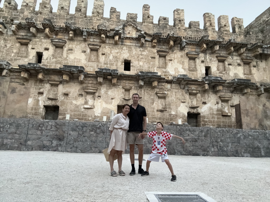 Tim, Miaomiao and Max at the orchestra in front of the stage building of the Roman Theatre of Aspendos