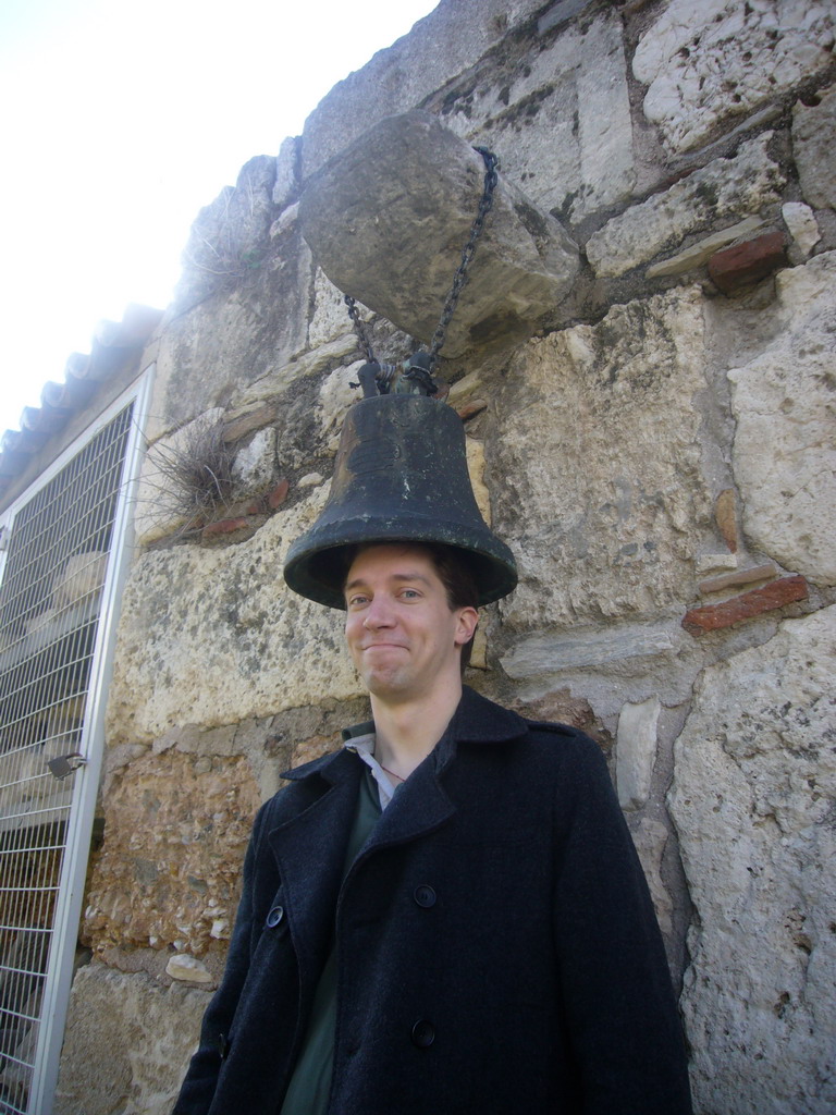 Tim with bell outside of Agii Apostoli Solaki