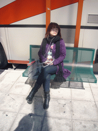 Miaomiao at a bus stop on the KTEL terminal