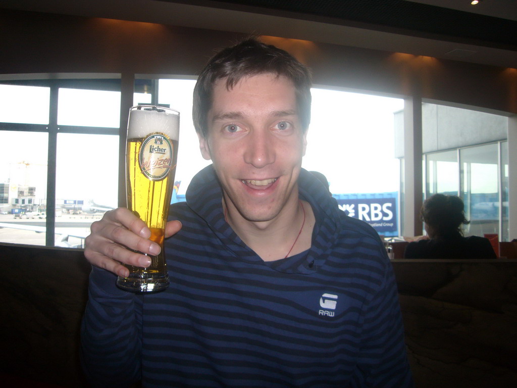 Tim with beer at Frankfurt Airport