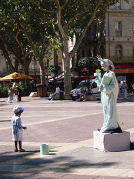 Living statue at the Place de l`Horloge square