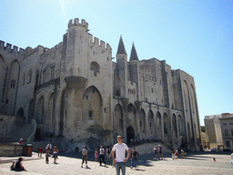 Tim at the Place du Palais square and the front of the Palais des Papes palace