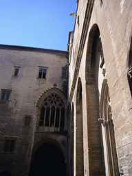 Walls and windows at the Cour d`Honneur courtyard at the Palais des Papes palace