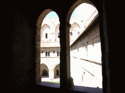 Window with a view on the Cloister at the Palais des Papes palace