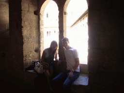 Tim and Miaomiao at a window with a view on the Cloister at the Palais des Papes palace