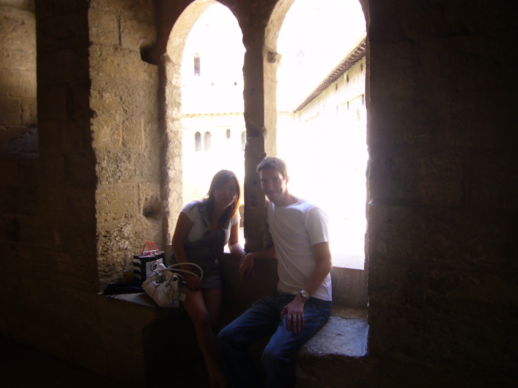 Tim and Miaomiao at a window with a view on the Cloister at the Palais des Papes palace