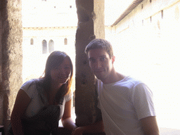 Tim and Miaomiao at a window with a view on the Cloister at the Palais des Papes palace
