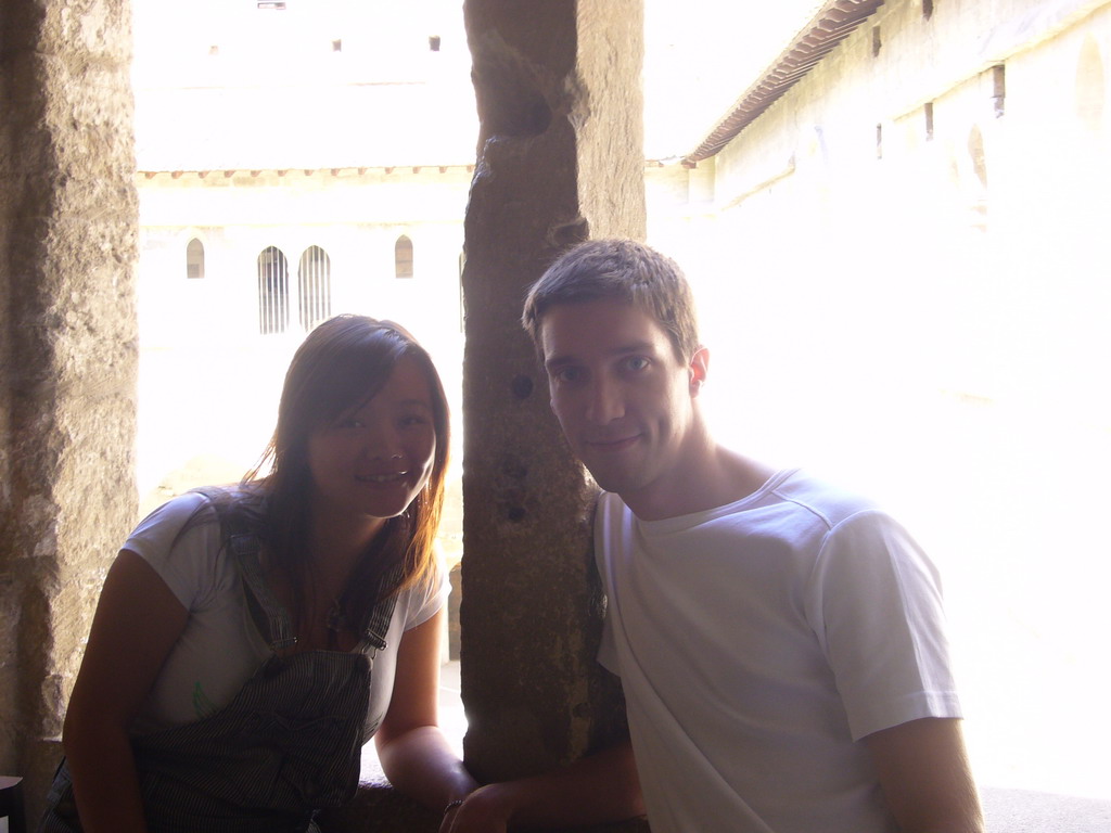 Tim and Miaomiao at a window with a view on the Cloister at the Palais des Papes palace