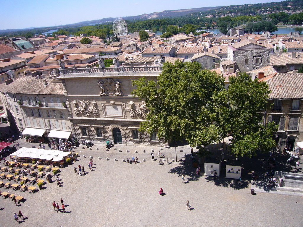 The south side of the Place du Palais square and a ferris wheel, viewed from the roof of the Palais des Papes palace