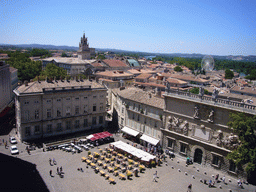 The south side of the Place du Palais square, the Clock Tower of the City Hall and a ferris wheel, viewed from the roof of the Palais des Papes palace