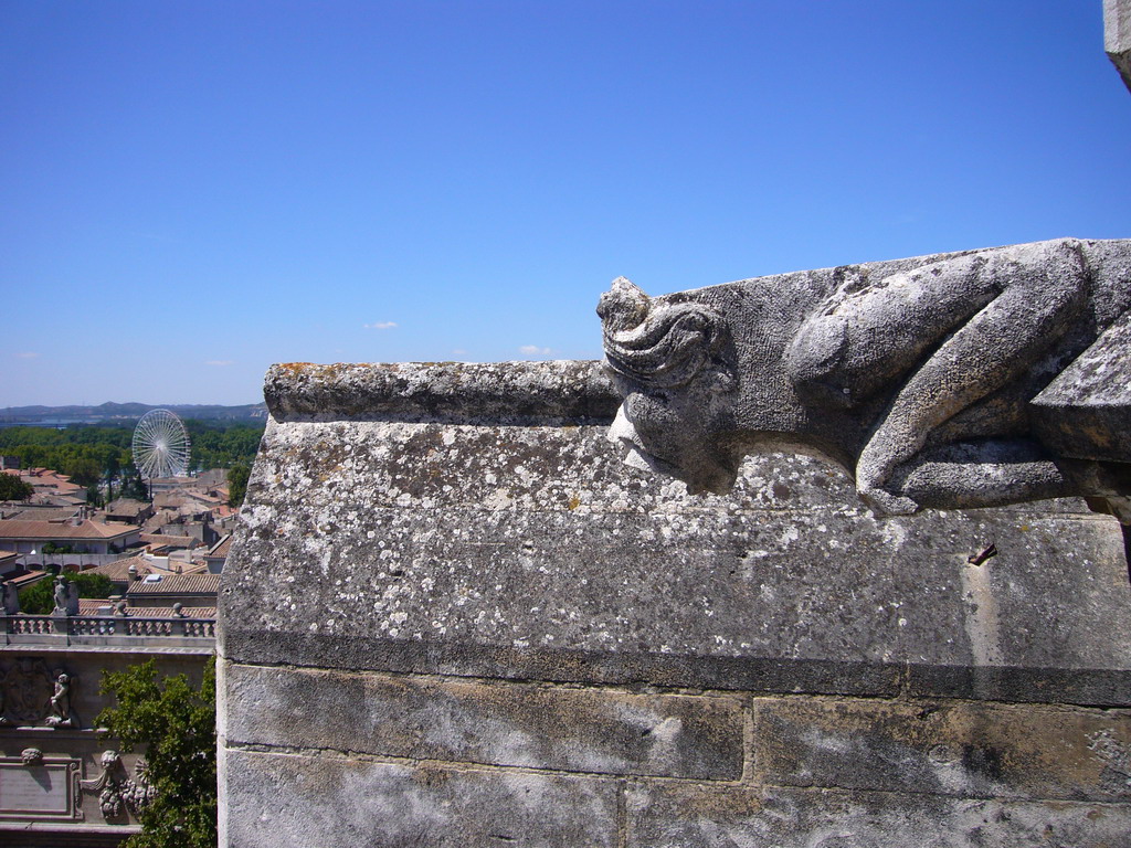 Wall with gargoyle and ferris wheel, viewed from the roof of the Palais des Papes palace