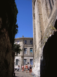 Southwest wall of the Palais des Papes palace and building with drawings on the windows