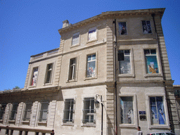 Building with drawings on the windows, at the southwest side of the Palais des Papes palace