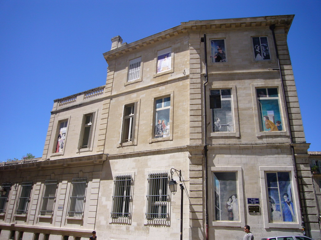 Building with drawings on the windows, at the southwest side of the Palais des Papes palace