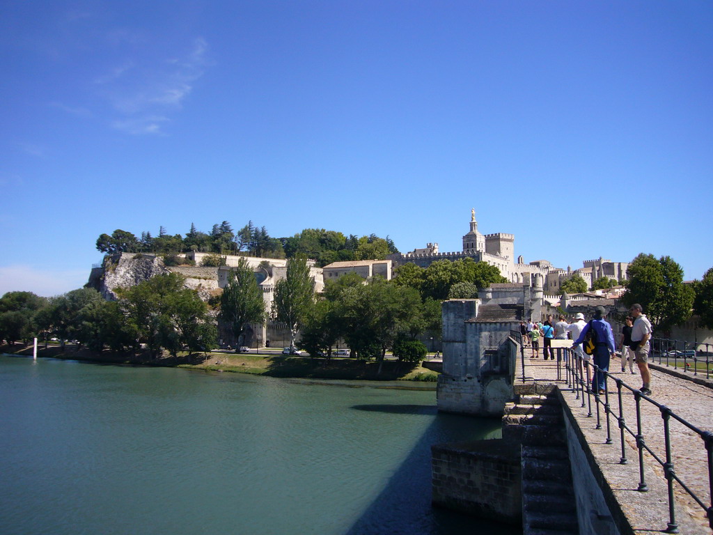 The Pont Saint-Bénezet bridge over the Rhône river, with a view on the Rocher des Doms gardens, the Avignon Cathedral and the Palais des Papes palace