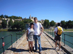 Tim and Miaomiao on the Pont Saint-Bénezet bridge over the Rhône river, with a view on the Rocher des Doms gardens, the Avignon Cathedral and the Palais des Papes palace