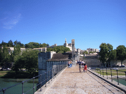 The Pont Saint-Bénezet bridge over the Rhône river, with a view on the Rocher des Doms gardens, the Avignon Cathedral and the Palais des Papes palace
