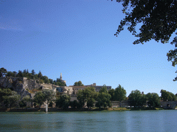 The Pont Saint-Bénezet bridge over the Rhône river, the Rocher des Doms gardens, the Avignon Cathedral and the Palais des Papes palace, viewed from the Chemin de la Traille street