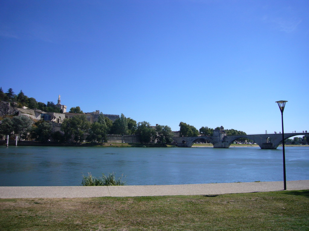 The Pont Saint-Bénezet bridge over the Rhône river, the Avignon Cathedral and the Palais des Papes palace, viewed from the Chemin de la Traille street