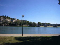 The Pont Saint-Bénezet bridge over the Rhône river, the Avignon Cathedral and the Palais des Papes palace, viewed from the Chemin de la Traille street