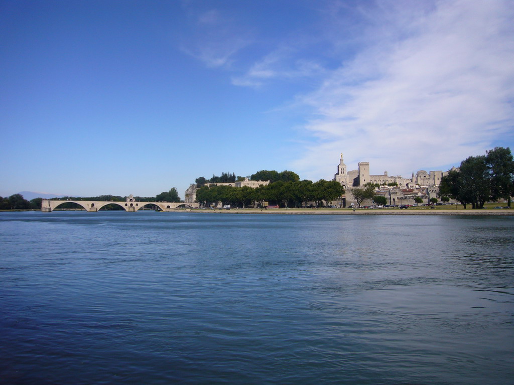 The Pont Saint-Bénezet bridge over the Rhône river, the Rocher des Doms gardens, the Avignon Cathedral and the Palais des Papes palace, viewed from the Chemin des Berges street