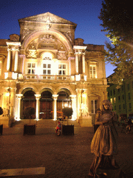 Living statue in front of the Opera Grand Avignon at the Place de l`Horloge square, by night