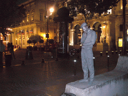 Living statue in front of the Opera Grand Avignon at the Place de l`Horloge square, by night