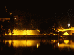 The Pont Saint-Bénezet bridge over the Rhône river, the Rocher des Doms gardens and the Gilded statue of the Virgin Mary at the top of the Avignon Cathedral, viewed from the Chemin de la Traille street, by night