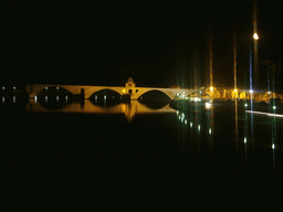 The Pont Saint-Bénezet bridge over the Rhône river, viewed from the Pont Édouard Daladier bridge, by night