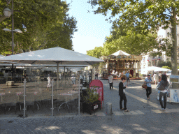 The Place de l`Horloge square with a carousel