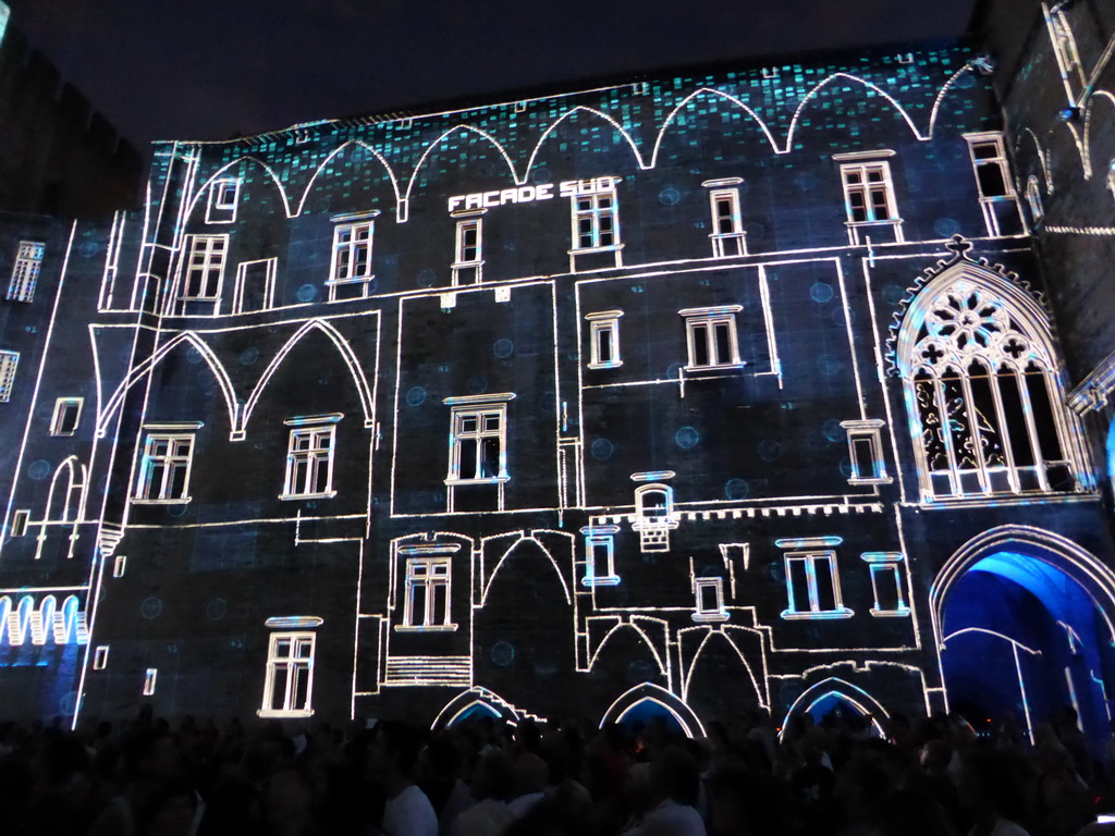 The southern wall at the Cour d`Honneur courtyard of the Palais des Papes palace, during the Les Luminessences d`Avignon light show, by night