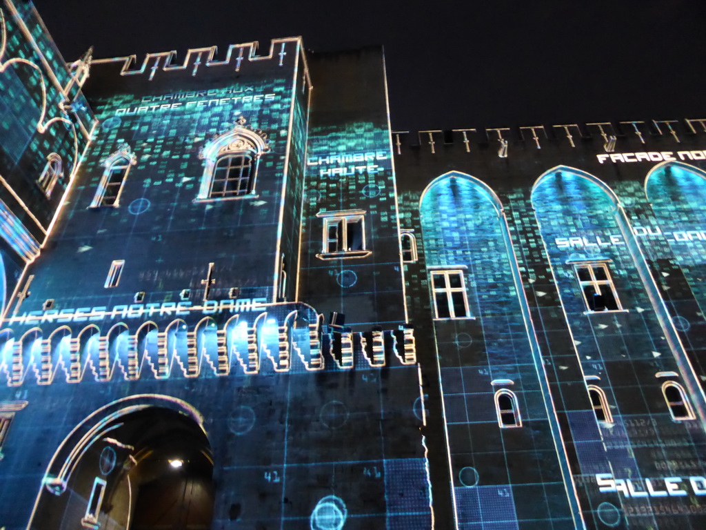 The northern wall at the Cour d`Honneur courtyard of the Palais des Papes palace, during the Les Luminessences d`Avignon light show, by night