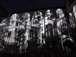 The southern wall at the Cour d`Honneur courtyard of the Palais des Papes palace, during the Les Luminessences d`Avignon light show, by night