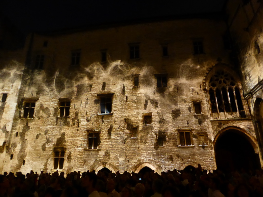 The southern wall at the Cour d`Honneur courtyard of the Palais des Papes palace, during the Les Luminessences d`Avignon light show, by night